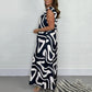 👗52% OFF NOW ! ✨Women's Ruffled Wide‑Leg Jumpsuit – Geometric Print V‑Neck One‑Piece Outfit